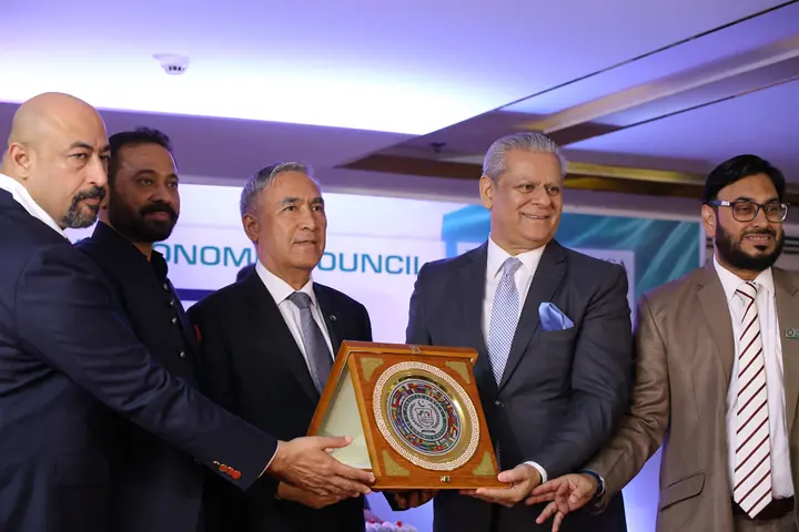 PAC Leadership presenting PAC souvenir shield to Honorable Guest.