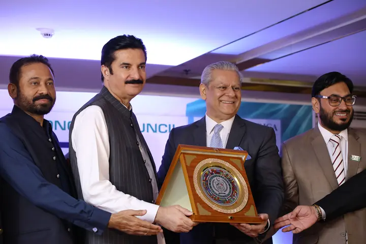 PAC Leadership presenting PAC souvenir shield to Honorable Guest.