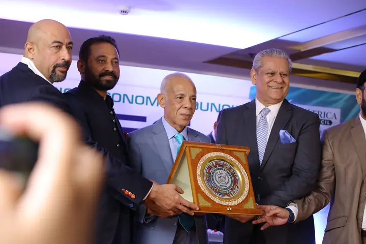 PAC Leadership presenting PAC souvenir shield to Honorable Guest.