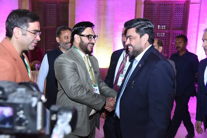 PAEC leaders and guests exchanging greetings during the ceremony.
