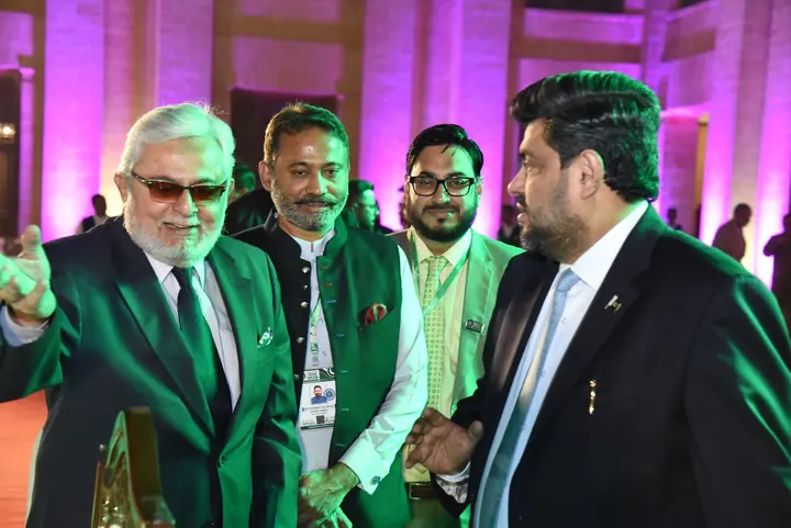 Council members in conversation during the event.